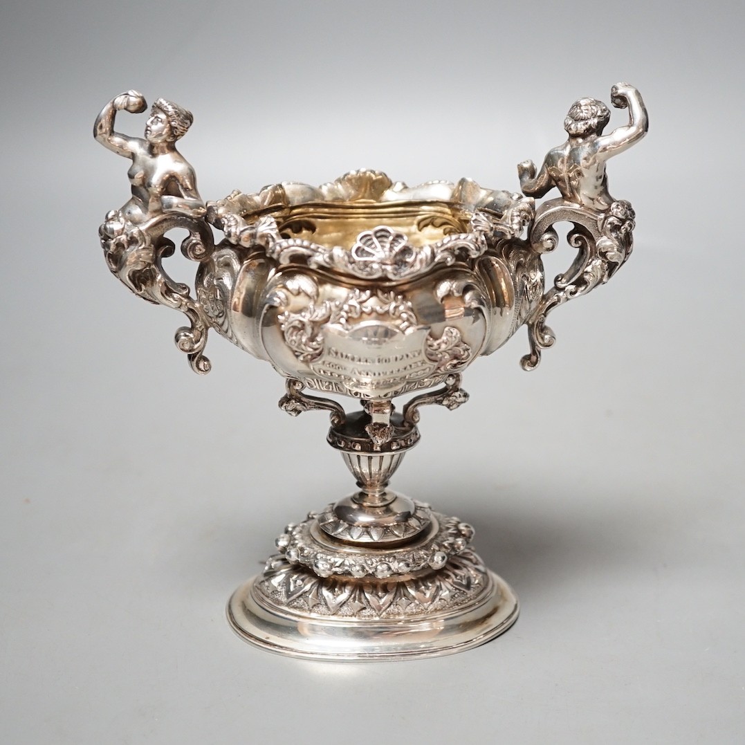 A late Victorian ornate small silver presentation centrepiece, by Carrington & Co, London, 1893, inscribed 'The Salter's Company 500th Anniversary, 1394 April 13th 1894', height 15.1cm, 11.5oz.